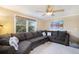Stylish living room featuring a large window, plush seating, and modern decor at 7780 S Kendall Blvd, Littleton, CO 80128