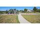 A well-maintained playground with various play structures and a walking path at 7780 S Kendall Blvd, Littleton, CO 80128