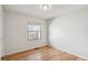 Well-lit bedroom with hardwood floors and a window providing natural light at 1383 W 88Th Ave # 307, Thornton, CO 80260