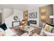 Living room with fireplace, large windows, and stylish decor at 4101 Marble Dr, Mead, CO 80504