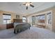 Main bedroom with large windows and ceiling fan at 4742 S Coolidge St, Aurora, CO 80016