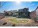 Well-maintained backyard with lawn and rock features, showcasing the home's exterior and outdoor space at 655 Tiger Lily Way, Highlands Ranch, CO 80126