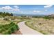 Picturesque walking path with mountain views, promoting an active lifestyle and connection to nature at 655 Tiger Lily Way, Highlands Ranch, CO 80126
