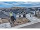 Lovely aerial view of home featuring a three-car garage, tidy yard, and beautiful mountain views at 815 Alumroot St, Castle Rock, CO 80104
