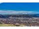 Breathtaking aerial view showcasing the vast landscape with snow-capped mountains and lush greenery at 815 Alumroot St, Castle Rock, CO 80104