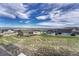 Stunning aerial view of a neighborhood boasting well-maintained yards and breathtaking mountain scenery at 815 Alumroot St, Castle Rock, CO 80104