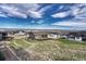Gorgeous aerial view of a neighborhood with expansive green spaces and beautiful mountain views at 815 Alumroot St, Castle Rock, CO 80104