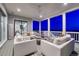 Inviting covered deck with stylish furniture, offering a serene space to enjoy the evening ambiance and distant views at 815 Alumroot St, Castle Rock, CO 80104