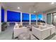 Chic covered deck featuring plush seating, ideal for evening gatherings with beautiful city views and ample space at 815 Alumroot St, Castle Rock, CO 80104