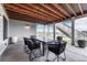 Relaxing covered patio with a dining table and scenic views, perfect for outdoor meals and gatherings at 815 Alumroot St, Castle Rock, CO 80104