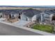 Attractive home exterior with three-car garage, low-maintenance yard, and mountain views at 815 Alumroot St, Castle Rock, CO 80104