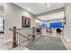 Bright hallway showcasing wood floors and stylish decor, with views into the living area at 815 Alumroot St, Castle Rock, CO 80104