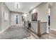 Spacious hallway featuring hardwood floors, neutral paint, and natural lighting at 815 Alumroot St, Castle Rock, CO 80104