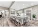 Kitchen island with bar seating, white cabinets and stainless appliances at 815 Alumroot St, Castle Rock, CO 80104