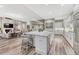 Open-concept kitchen with granite counters and island with bar seating at 815 Alumroot St, Castle Rock, CO 80104