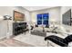 Living room with a piano, sofa, and a large window with views at 815 Alumroot St, Castle Rock, CO 80104