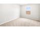 Bright bedroom with a large window and neutral carpet at 8840 Sedalia St, Commerce City, CO 80022