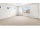 Spacious bedroom featuring plush carpeting, natural light, and a serene atmosphere at 8840 Sedalia St, Commerce City, CO 80022