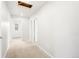 Hallway features neutral paint, plush carpeting, and ample lighting at 8840 Sedalia St, Commerce City, CO 80022