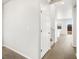 Bright hallway with sleek, modern flooring leading to the staircase at 8840 Sedalia St, Commerce City, CO 80022