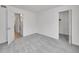 Neutral bedroom with carpet and two entryways; one to a closet and one to another room at 11985 E Harvard Ave # 108, Aurora, CO 80014