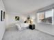 Serene bedroom featuring soft carpet, a comfortable bed, and ample natural light at 11985 E Harvard Ave # 108, Aurora, CO 80014