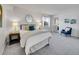 Inviting bedroom with soft carpet, a comfortable bed, and a relaxing ambiance at 11985 E Harvard Ave # 108, Aurora, CO 80014