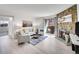 Comfortable living room with stone fireplace and access to a balcony at 11985 E Harvard Ave # 108, Aurora, CO 80014