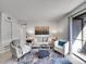 Bright living room with modern decor and sliding glass doors at 11985 E Harvard Ave # 108, Aurora, CO 80014