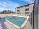 Community pool covered for the winter season with lounge chairs for residents to enjoy in the summer at 11985 E Harvard Ave # 108, Aurora, CO 80014