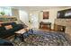 Finished basement with a cozy sitting area and fireplace at 1303 Newport St, Denver, CO 80220