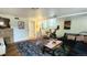 Finished basement with exercise equipment and comfortable seating at 1303 Newport St, Denver, CO 80220