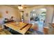 Spacious dining area with a large wooden table and hardwood floors at 1303 Newport St, Denver, CO 80220
