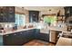Updated kitchen featuring stainless steel appliances and farmhouse sink at 1303 Newport St, Denver, CO 80220