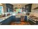 Modern kitchen with white quartz countertops and dark cabinetry at 1303 Newport St, Denver, CO 80220