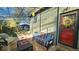 Covered patio with seating area and backyard access at 1303 Newport St, Denver, CO 80220
