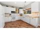Modern kitchen featuring white cabinets, wood countertops, and stainless steel appliances at 22142 E Belleview Place, Aurora, CO 80015