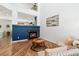 Bright living room with a fireplace, wood floors, and stylish decor at 22142 E Belleview Place, Aurora, CO 80015