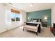 Serene bedroom with a large window, neutral decor, and ample natural light at 22142 E Belleview Place, Aurora, CO 80015