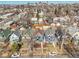 An overhead shot of a quaint neighborhood with colorful homes and mature trees lining the streets at 169 W Byers Pl, Denver, CO 80223