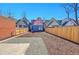 This backyard features a concrete patio, wooden fencing, and freshly laid mulch, perfect for outdoor living at 169 W Byers Pl, Denver, CO 80223