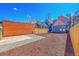 This backyard features a concrete patio, wooden fencing, and freshly laid mulch, perfect for outdoor living at 169 W Byers Pl, Denver, CO 80223