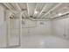 Spacious unfinished basement features exposed ceiling beams, a concrete floor, and natural light at 169 W Byers Pl, Denver, CO 80223