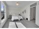 Light-filled bedroom with plush carpeting, a comfortable bed, and ample natural light from the large window at 169 W Byers Pl, Denver, CO 80223