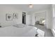 Bright bedroom featuring plush carpeting, a comfortable bed, and ample natural light from the large window at 169 W Byers Pl, Denver, CO 80223