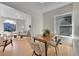 Bright dining space with hardwood floors, natural light, and open access to the living room at 169 W Byers Pl, Denver, CO 80223