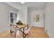 Bright dining area with hardwood floors, modern furniture, and a stylish table centerpiece at 169 W Byers Pl, Denver, CO 80223