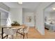 Dining room featuring hardwood floors and an adjacent bedroom, creating a flowing and open feel at 169 W Byers Pl, Denver, CO 80223