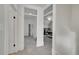 Hallway featuring neutral walls, plush carpet, and arched doorways that open into other rooms of the house at 169 W Byers Pl, Denver, CO 80223