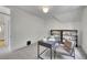 Bright office space features a dark work desk and shelving, offering a modern workspace at 169 W Byers Pl, Denver, CO 80223